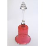 A Victorian cranberry glass bell engraved ' Mr & Mrs Ansell,