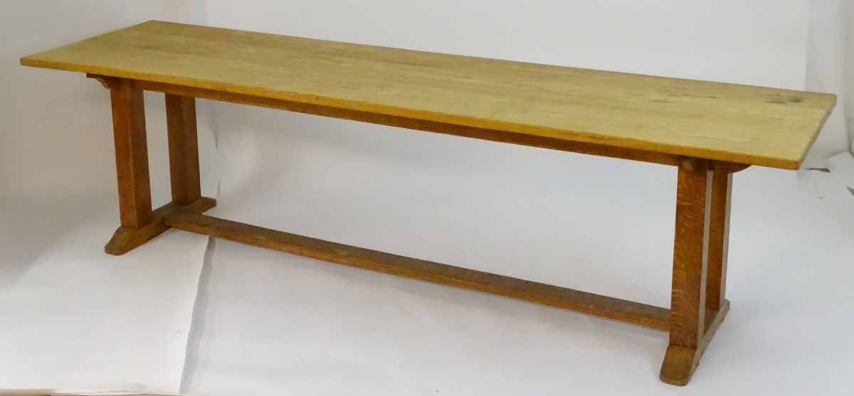 An early 20thC large Arts & Crafts style oak dining / refectory table with a rectangular top above - Image 6 of 9