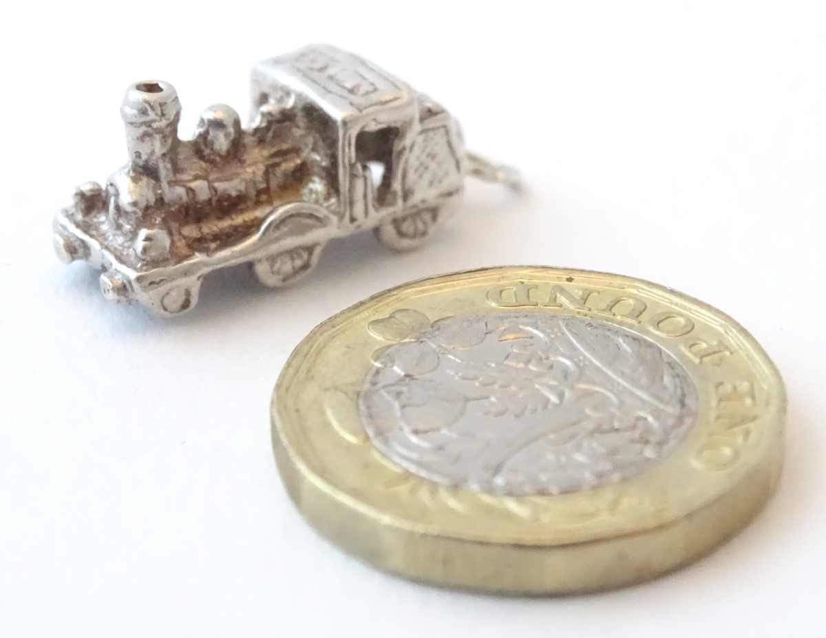 A novelty silver pendant charm formed as a steam train. Approx. 3/4" long. - Image 4 of 6