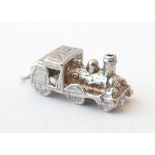 A novelty silver pendant charm formed as a steam train. Approx. 3/4" long.