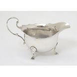 A small silver cream / sauce jug hallmarked Birmingham 1922 maker Adie Bros Ltd.