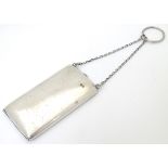 A small silver cheroot case with hanging chain.