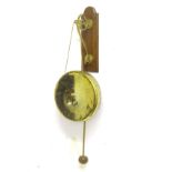A c1900 wall hanging gong, affixed to a brass and oak hanger, with associated mallet,