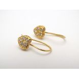 A pair of 9ct gold earrings set with 5 cubic zirconia in a heart shaped setting. Approx. 1/2" long.