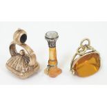 Three various 19thC pendant fob seals including a rotating seal in a gilt metal mount The largest 1