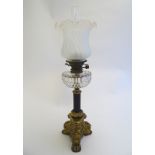 A late Victorian Hinks oil lamp, with opaque glass shade,