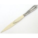 A Continental silver handled letter opener / paper/ letter clip.
