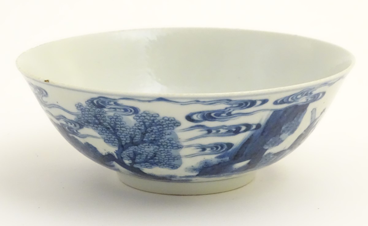 A Chinese blue and white bowl depicting figures in a landscape. Character marks under. - Image 5 of 8