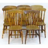 A set of eight lathe back Windsor dining chairs with curved top rails,