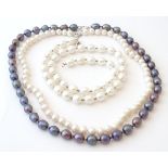 Three various pearl necklaces with silver clasps. The longest approx.
