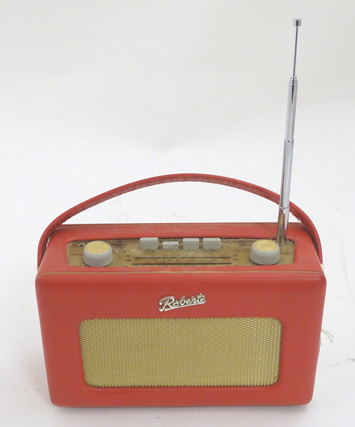 A late 20thC Roberts R250 portable radio, with red vinyl covering,