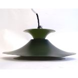 A vintage retro pendant light, in dark green and lime finish with white interior,