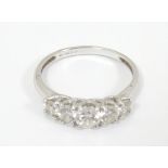 A 14ct white gold ring set with 5 graduated cubic zirconia. Ring size approx.