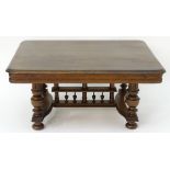 A 20thC oak table with a rectangular moulded top,