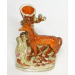 A Staffordshire flat backed fox and game bird spill vase, 8" high,