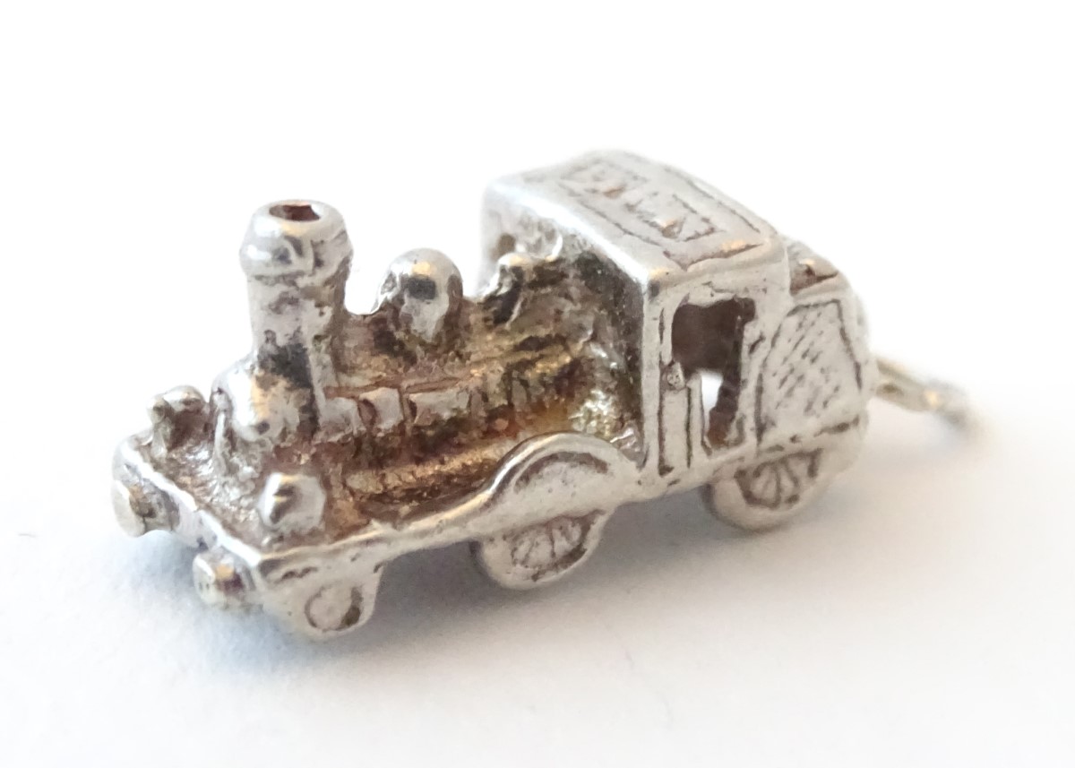 A novelty silver pendant charm formed as a steam train. Approx. 3/4" long. - Image 3 of 6