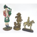 Three assorted door stoppers, formed as a man on horseback,