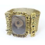 Mourning / Memorial jewellery : A 19thC gold and gilt metal mourning bracelet of cuff form with
