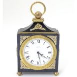 A 20thC Swiss mantle / alarm clock with an 8 day movement,