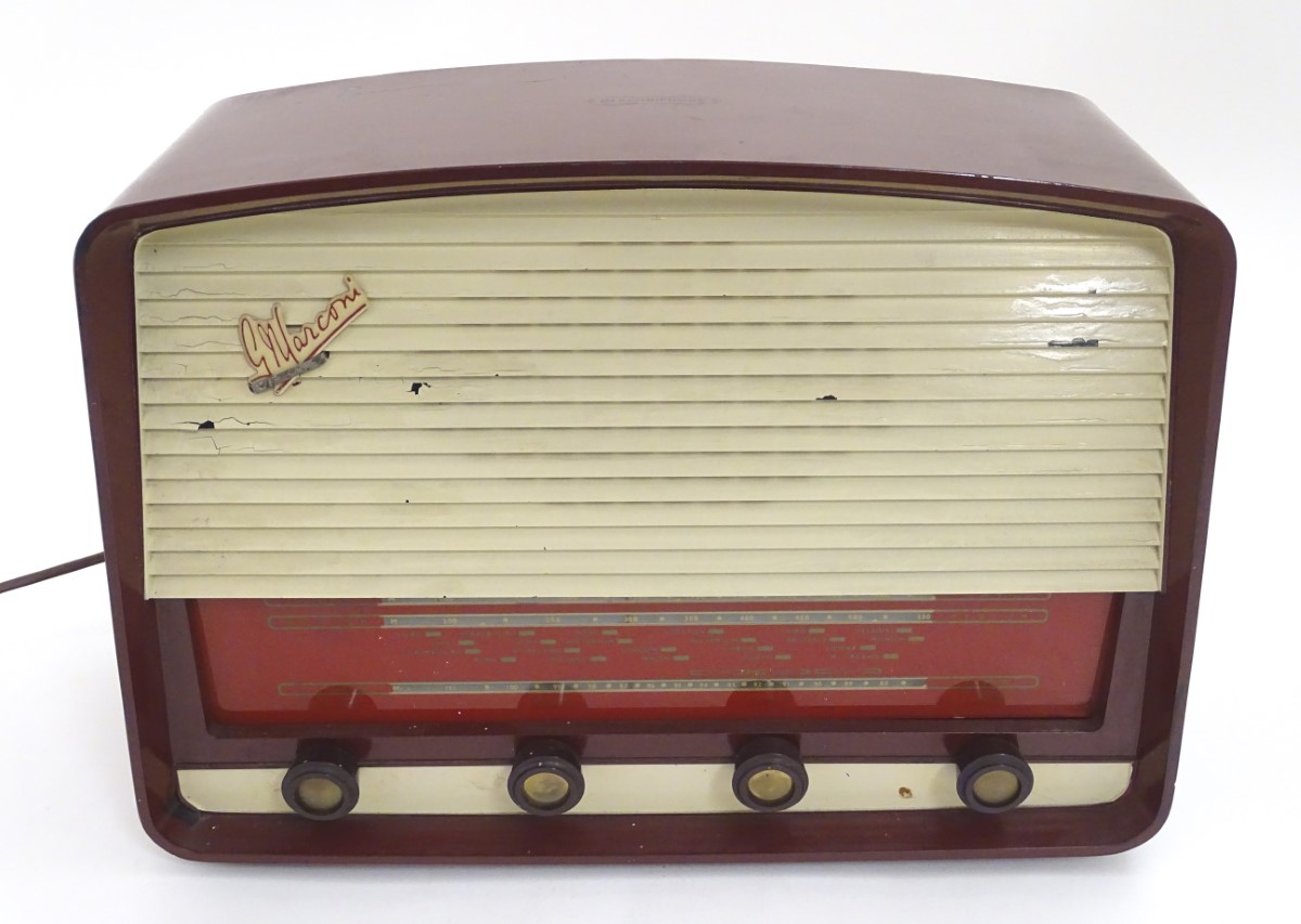 A 1950s / 1960s Marconi Marconiphone T69DA valve radio, with burgundy cover and white detail,