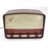 A 1950s / 1960s Marconi Marconiphone T69DA valve radio, with burgundy cover and white detail,