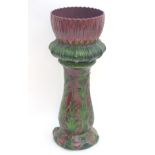 A large Victorian majolica jardiniere on stand of stylised flower form. Approx.