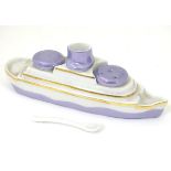 A novelty French porcelain cruet set formed as a boat / ship,