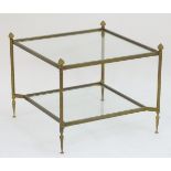 A 20thC two tier gilt and brass coffee table.