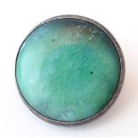 An Arts & Crafts white metal brooch set with ceramic green Astra Minton high fired cabochon. Approx.