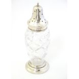 A cut glass sugar shaker / caster / muffineer with silver top hallmarked London 1935 with jubilee