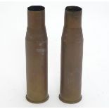 Militaria: a pair of 20thC 40mm Bofors cannon shell cases, headstamped 'M23 A2.