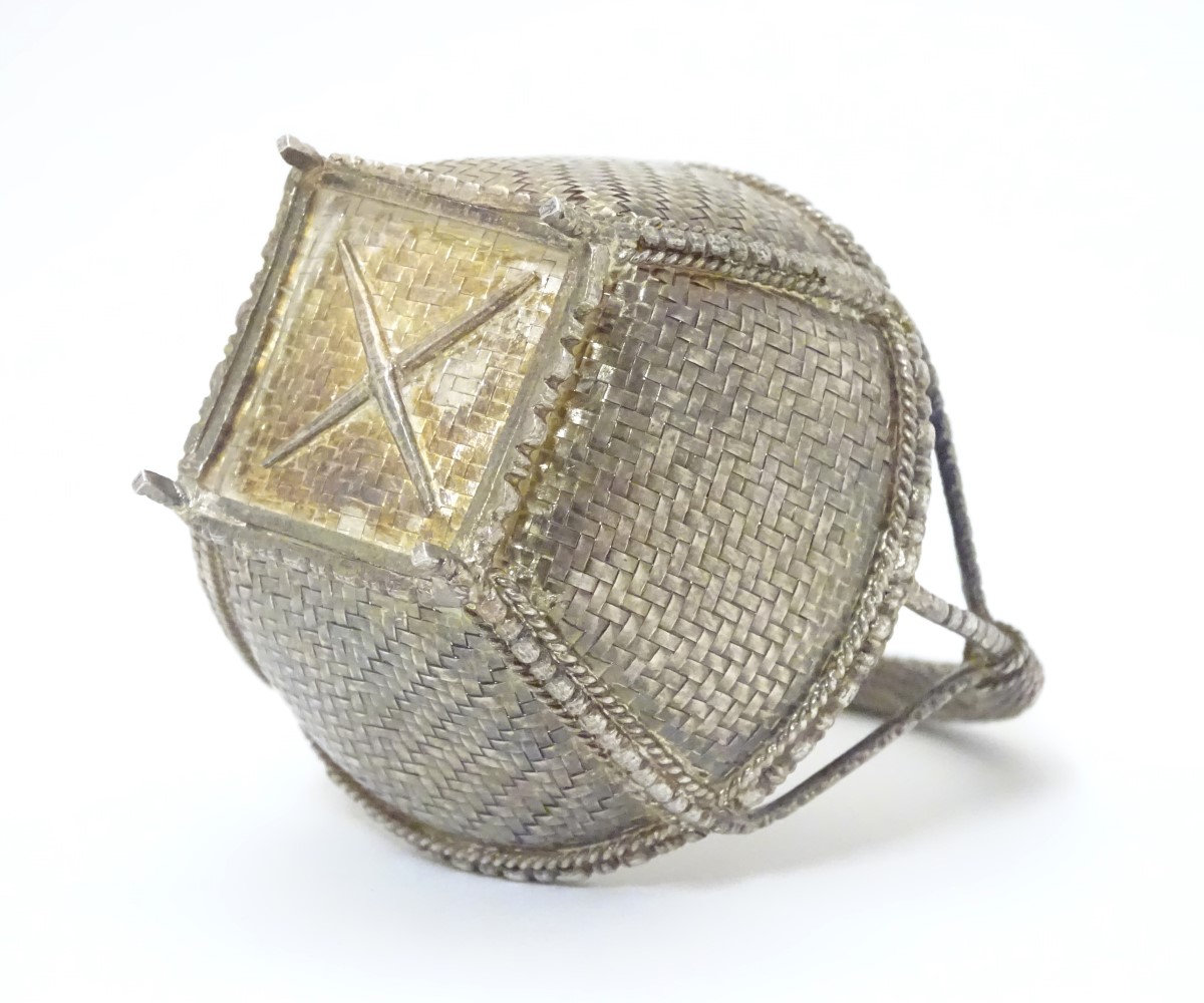 A white metal dish formed as a woven basket. - Image 2 of 5