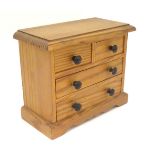A 19th / 20thC miniature apprentice piece pine chest of drawers. Approx.