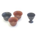Four 19thC Turkish Tophane pottery cups, three with flared rims and incised decoration of stylised