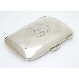 A silver cigarette case hallmarked Birmingham 1924 maker William Hair Haseler. 3" x 2" Please Note -