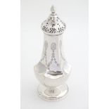 A silver sugar caster hallmarked Birmingham c.1911. Maker Henry Matthews. 7 1/2" High (154g)