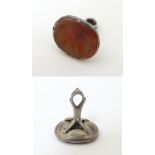 A 19thC fob seal set with carved carnelian seal under depicting the head of a classical man 7/8"
