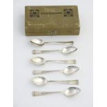 A cased set of 6 WMF teaspoons with Art Nouveau style decoration, marked 18 and retailed by A. Junod