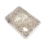 A silver visiting card case with embossed decoration depicting a stag in landscape. hallmarked