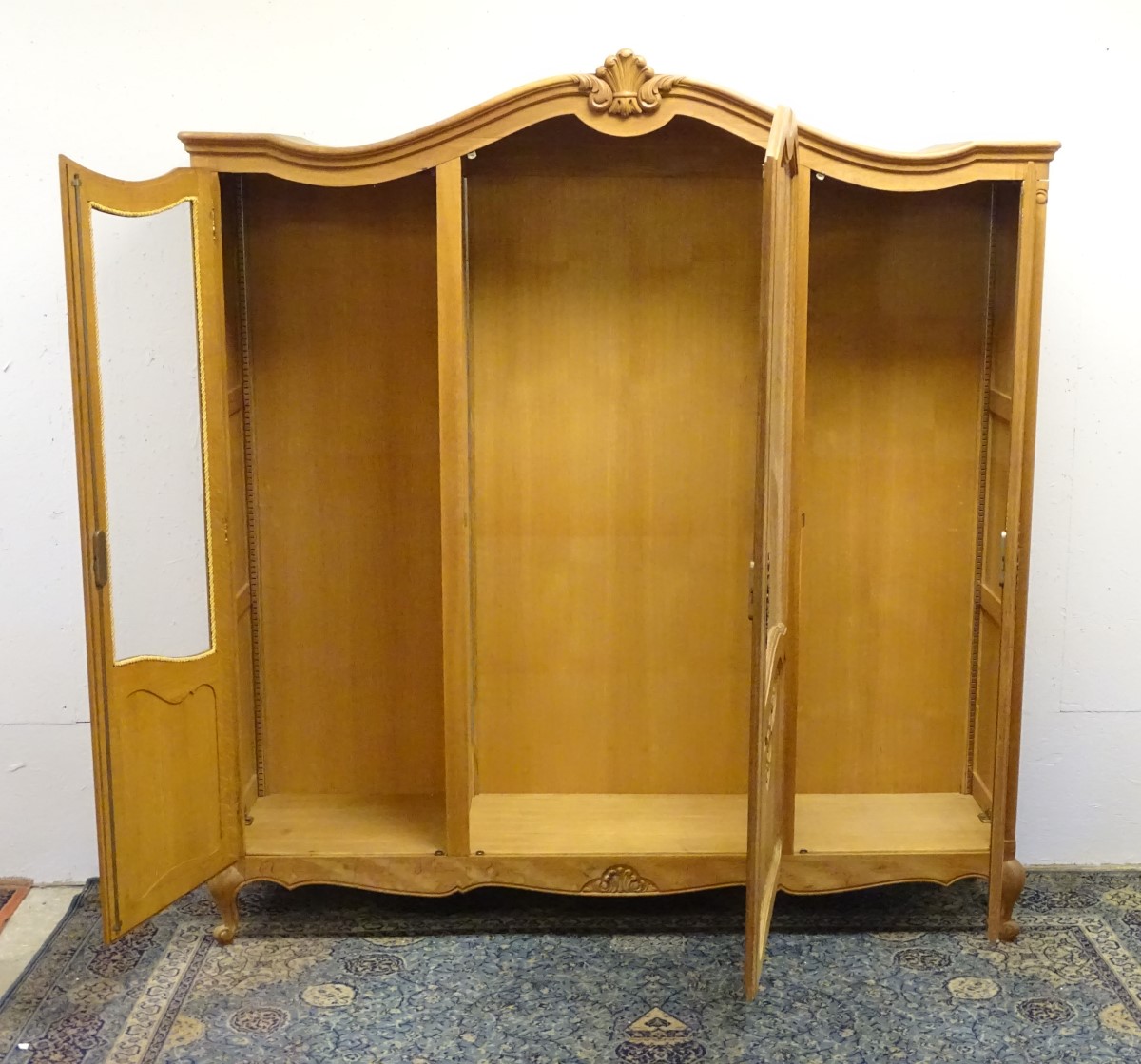An early 20thC oak vitrine / armoire with a shell carved top and three glazed doors with carved - Image 3 of 8