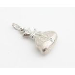 A novelty silver charm / pendant formed as a money bag. Approx 1" long Please Note - we do not