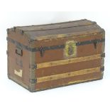 A Victorian wooden casket on castors with metal strapping. carrying handles and initialled 'L.S'.