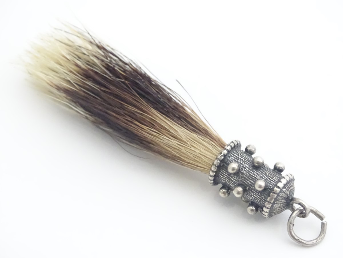 A Victorian hunting trophy pendant set with badger bristle with .800 German silver mount 2 3/4" long