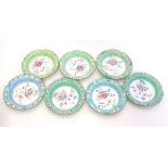 Seven Chinese enamel dishes / ashtrays with handpainted decoration depicting flowers, birds,