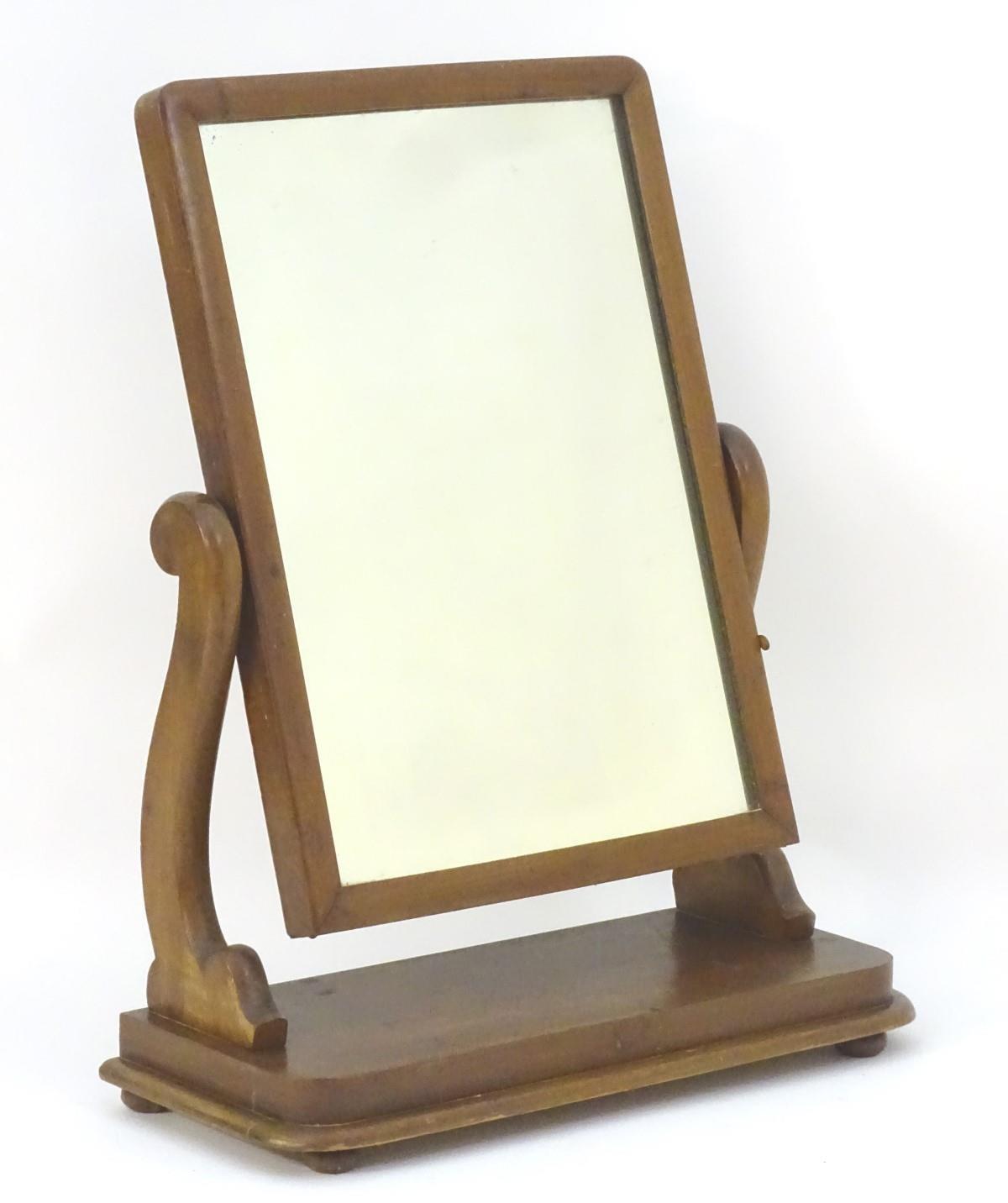 An early / mid 19thC mahogany toilet / dressing mirror with scrolled supports and a rectangular - Image 3 of 6