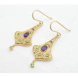 A pair of silver gilt drop earrings set with amethysts and peridot. 1 1/2" long Please Note - we