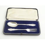 A cased silver Christening set comprising silver fork and spoon. Hallmarked Sheffield 1933 maker