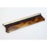 A silver mounted comb hallmarked London 1976 maker Charles S Green & Co Ltd. 5 1/2" long Please Note