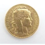 A French Republic 20 franc gold coin, 1907, approximately 6.5g Please Note - we do not make