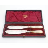A pair of 19thC close plate butter knives with mother of pearl handles. Cased. 7 1/2" long Please